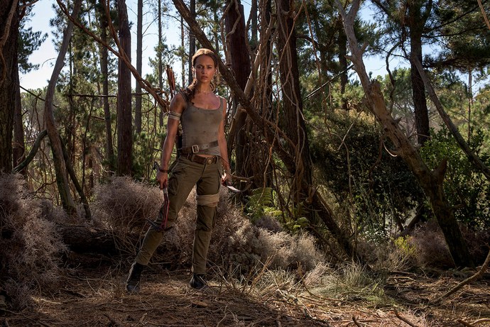 Alicia Vikander in the woods as Lara Croft